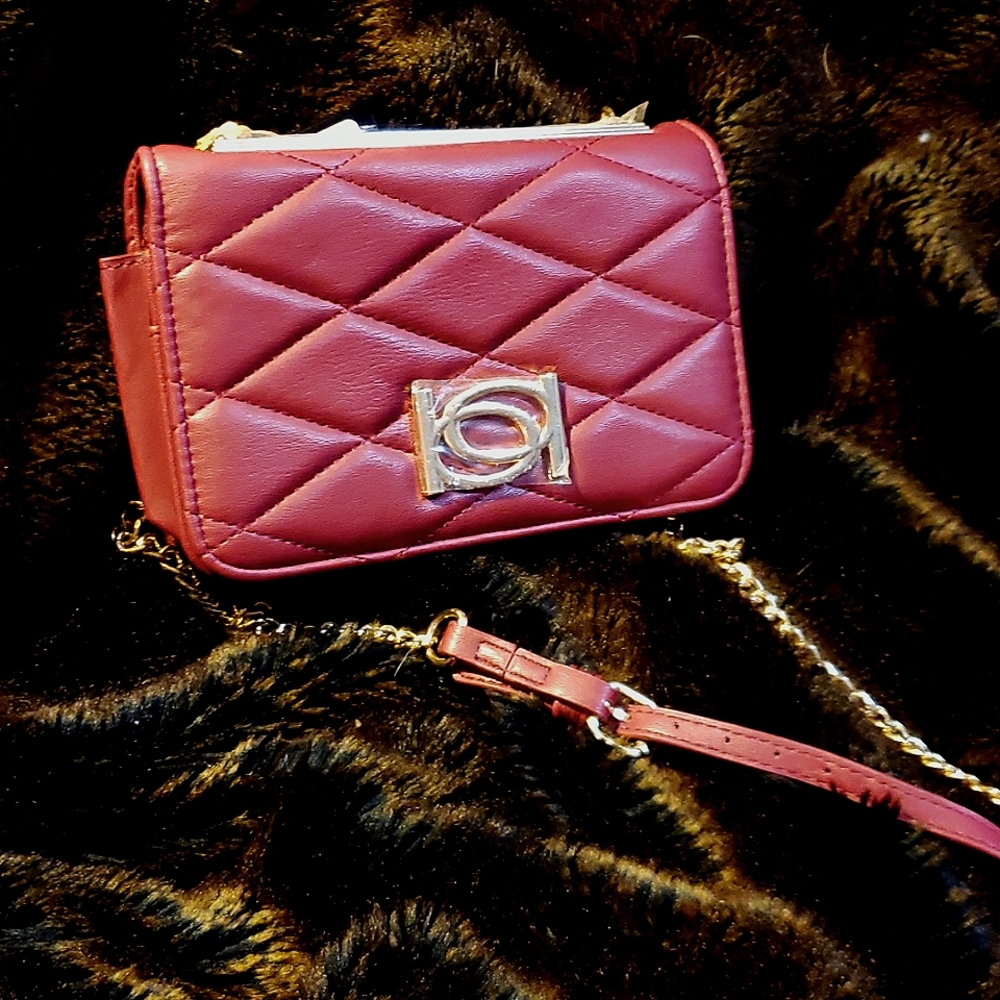 A red Bebe Satchel purse